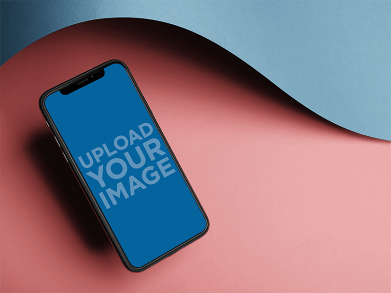 Iphone X Mockup Floating Angled Near A Curved Paper A20005
