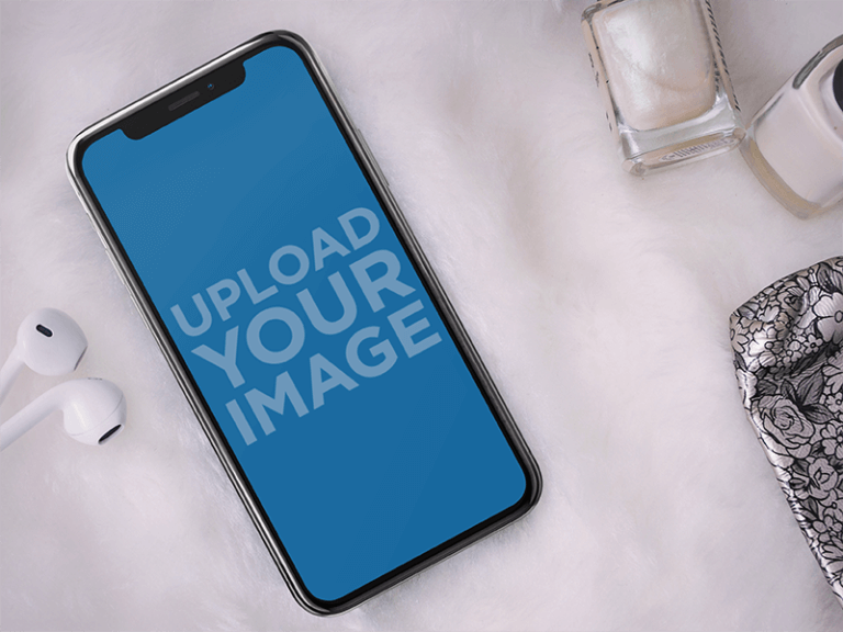 Iphone X Mockup Lying Next To Nail Products And Earphones A17545